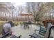 Outdoor deck with seating, dining area, and shade, perfect for relaxing and entertaining guests at 2010 Twin Acres Rd, Clayton, NC 27520
