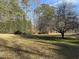 Large, flat, and well-maintained backyard features mature trees, open space, and room for recreation at 2010 Twin Acres Rd, Clayton, NC 27520