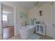 Bathroom displaying a standalone tub, modern fixtures, and decor; bright with natural light at 2010 Twin Acres Rd, Clayton, NC 27520