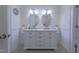Bathroom featuring a double sink vanity with modern fixtures and stylish lighting, offering ample counter space at 2010 Twin Acres Rd, Clayton, NC 27520