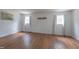 Empty Bedroom with two windows, wood floors and white walls at 2010 Twin Acres Rd, Clayton, NC 27520