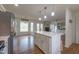 Open-concept kitchen with an island, stainless steel appliances, and hardwood floors, great for entertaining at 2010 Twin Acres Rd, Clayton, NC 27520