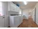 Laundry room features new washer and dryer, with storage, and lots of space at 2010 Twin Acres Rd, Clayton, NC 27520