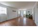 Bright living room featuring hardwood floors, white walls, and a comfortable chair near windows at 2010 Twin Acres Rd, Clayton, NC 27520