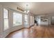 Open living area featuring a bay window, fireplace, and wood flooring at 2010 Twin Acres Rd, Clayton, NC 27520