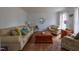 Comfortable living room featuring a couch, chairs, and hardwood flooring at 2010 Twin Acres Rd, Clayton, NC 27520