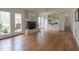 Open living area with fireplace, built-in shelving, and French doors leading to the outdoor patio at 2010 Twin Acres Rd, Clayton, NC 27520