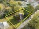 Aerial view of a charming home with a large yard in a neighborhood, property lines are estimated at 219 N Richardson Ave, Nashville, NC 27856