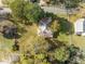 Birds-eye view of a charming home, nestled among mature trees, with a distinctive roof at 219 N Richardson Ave, Nashville, NC 27856