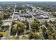 Wide aerial shot of a small town with houses surrounded by lots of trees at 219 N Richardson Ave, Nashville, NC 27856
