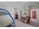 A vintage bedroom featuring a metal frame bunkbed and antique accents at 219 N Richardson Ave, Nashville, NC 27856