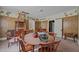 Dining room needing renovations, features a large table, chairs, and outdated decor at 219 N Richardson Ave, Nashville, NC 27856