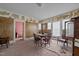 Dining room needing renovations, features a table and chairs, worn walls, and damaged decor at 219 N Richardson Ave, Nashville, NC 27856