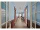 Charming hallway featuring blue walls, wood trim, and multiple doorways leading to other rooms at 219 N Richardson Ave, Nashville, NC 27856