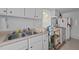 Modest kitchen features a stainless steel sink, white appliances, and efficient storage solutions at 219 N Richardson Ave, Nashville, NC 27856
