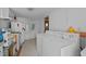 Functional laundry area with a washer and dryer set; includes a sink and essential appliances at 219 N Richardson Ave, Nashville, NC 27856