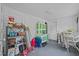 Versatile storage room with shelving and worktable; ideal for organizing supplies and projects at 219 N Richardson Ave, Nashville, NC 27856