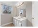 Bright bathroom with dual sinks, modern vanity, and a large mirror at 2605 Sumac Ln, Burlington, NC 27215