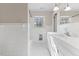 Bathroom featuring white tile, vanity, lighting, and a window at 2605 Sumac Ln, Burlington, NC 27215