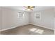 Bedroom featuring wood-look floors, windows, and ceiling fan at 2605 Sumac Ln, Burlington, NC 27215