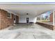 Attached carport with concrete flooring and a ceiling fan at 2605 Sumac Ln, Burlington, NC 27215