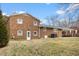 Two-story brick home with a white back door at 2605 Sumac Ln, Burlington, NC 27215