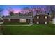 Charming brick home with a lush green lawn and a welcoming walkway to the front door at 2605 Sumac Ln, Burlington, NC 27215