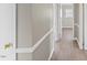 Bright hallway with wood-look floors and views to rooms at the end at 2605 Sumac Ln, Burlington, NC 27215