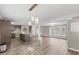 Spacious open concept, with luxury vinyl plank flooring, kitchen with granite countertops, and bar at 2605 Sumac Ln, Burlington, NC 27215