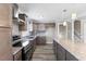 Well-designed kitchen with stainless steel appliances, granite countertops, and an island at 2605 Sumac Ln, Burlington, NC 27215