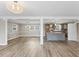 Open floor plan featuring luxury vinyl plank flooring, modern lighting, and a view of the kitchen at 2605 Sumac Ln, Burlington, NC 27215