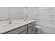 Bathroom featuring double sinks, granite countertops, and a bathtub at 266 Hanging Elm Ln, Fuquay Varina, NC 27526