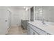 Spacious bathroom with double sinks, granite countertops, and a glass-enclosed shower at 266 Hanging Elm Ln, Fuquay Varina, NC 27526