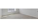 Bright bedroom with neutral walls, carpeted floors and natural light from a large window at 266 Hanging Elm Ln, Fuquay Varina, NC 27526