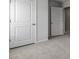 Bright bedroom featuring neutral walls, plush carpeting, and a double door closet at 266 Hanging Elm Ln, Fuquay Varina, NC 27526