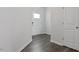 Bright entryway with durable wood flooring and white trim, leading to the rest of the home at 266 Hanging Elm Ln, Fuquay Varina, NC 27526