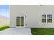 Rear exterior featuring siding, sliding glass doors, and a small concrete patio at 266 Hanging Elm Ln, Fuquay Varina, NC 27526