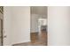 View of the front door opens to a foyer with wood floors leading into the living spaces at 266 Hanging Elm Ln, Fuquay Varina, NC 27526
