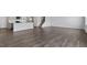 Open-concept living room featuring hard wood flooring, providing ample space for relaxation and entertainment at 266 Hanging Elm Ln, Fuquay Varina, NC 27526