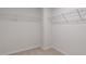 Empty walk-in closet with carpet flooring, wire shelving, and white trim in a new home at 266 Hanging Elm Ln, Fuquay Varina, NC 27526