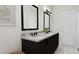 Elegant bathroom with a double vanity, modern fixtures, and stylish mirrors at 4073 Elk Creek Ln, Raleigh, NC 27612