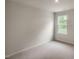 Neutral bedroom with a large window at 421 Citron St, Sanford, NC 27332