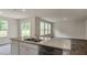 Kitchen island features stainless steel appliances and granite counters at 421 Citron St, Sanford, NC 27332