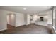 Open-concept living room and kitchen area, wood-look flooring, and ample natural light at 421 Citron St, Sanford, NC 27332