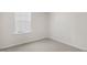 Empty room features neutral walls and carpet and a window for natural light at 425 Citron St, Sanford, NC 27332