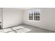 Bright bedroom featuring plush carpeting, neutral paint, and a large window at 425 Citron St, Sanford, NC 27332