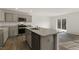 Modern kitchen with granite countertops, stainless steel appliances, and hardwood floors at 425 Citron St, Sanford, NC 27332