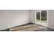 Bright living room with sliding glass doors leading to outdoor patio with great backyard view at 425 Citron St, Sanford, NC 27332
