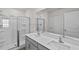 This bathroom features a double vanity and tiled shower at 429 Citron St, Sanford, NC 27332