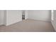 This bedroom is spacious with neutral colored walls and carpet at 429 Citron St, Sanford, NC 27332